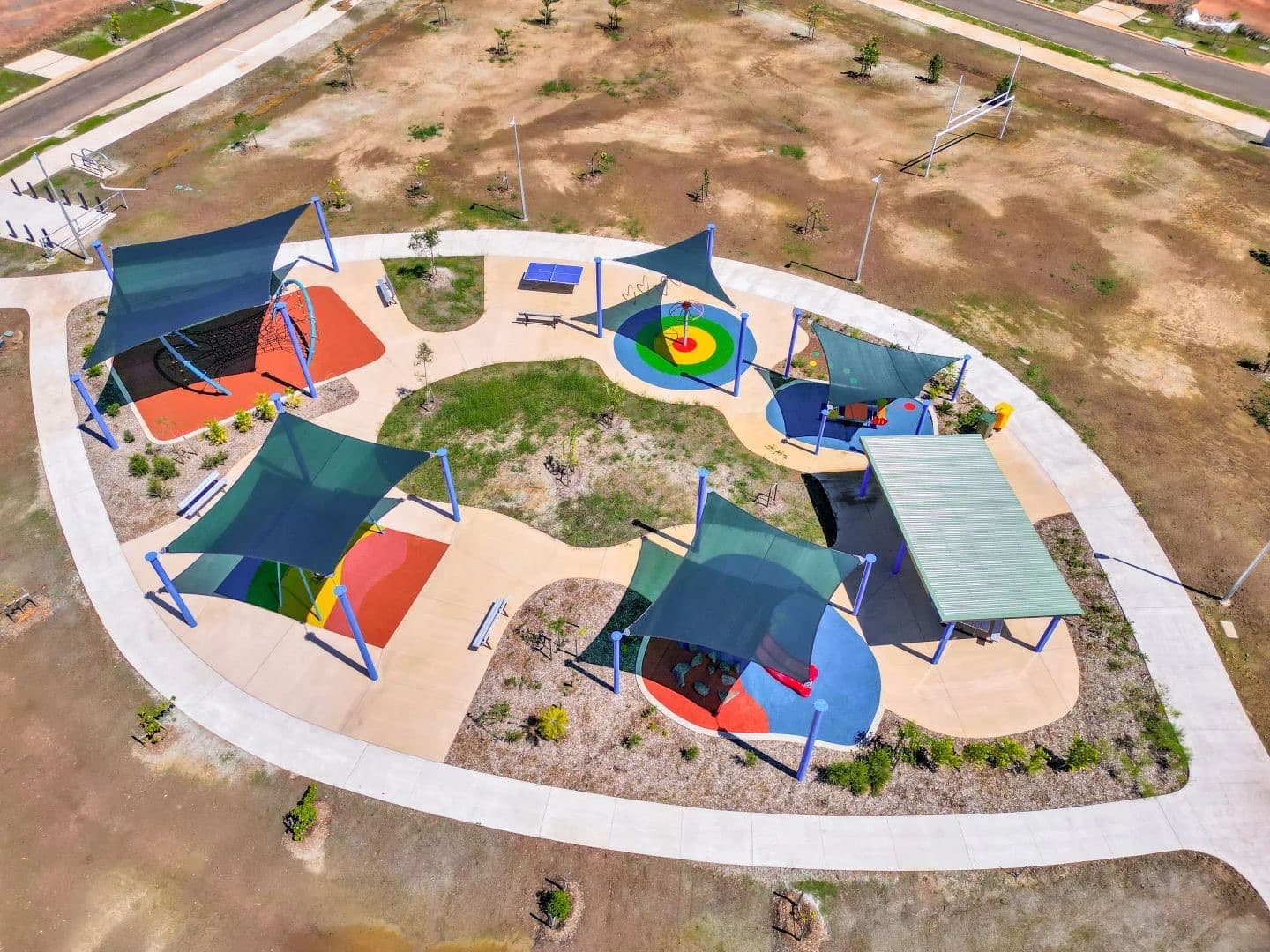 Aerial view of a completed Kidzspace park — play areas, shade sails, softfall and landscaping