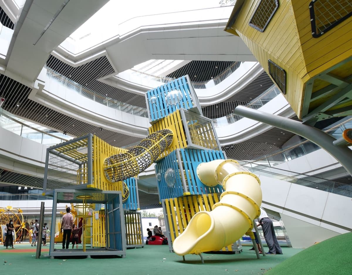 Colourful plastic playground panels and tube slides
